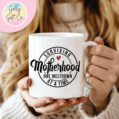 Surviving Motherhood One Meltdown at a Time - Funny Coffee Mug for Mom - Golly Gift Co